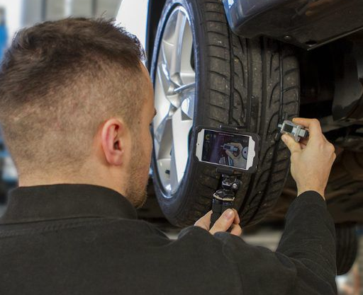 man checking tyre