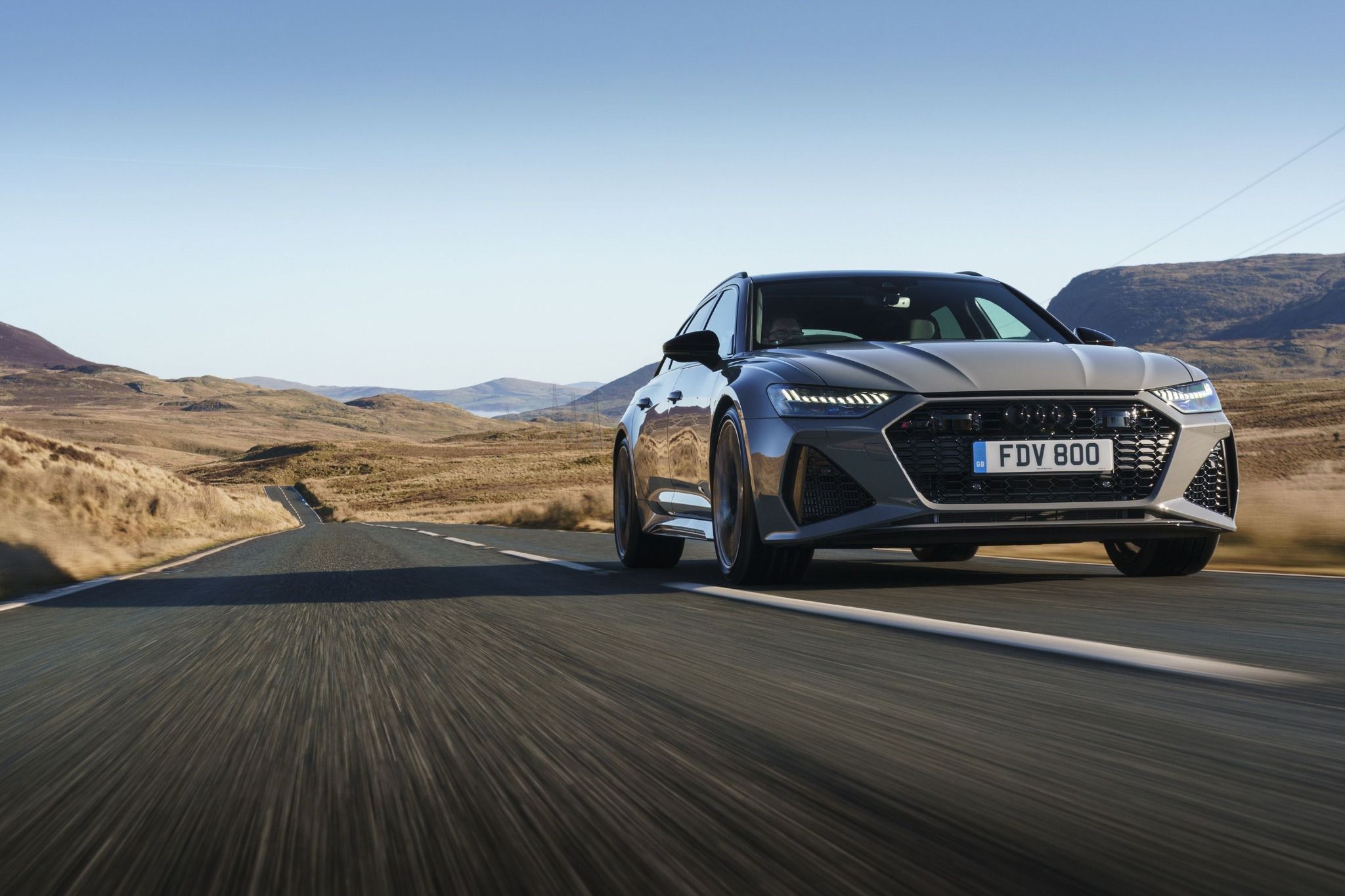 Grey RS6 driving on a road