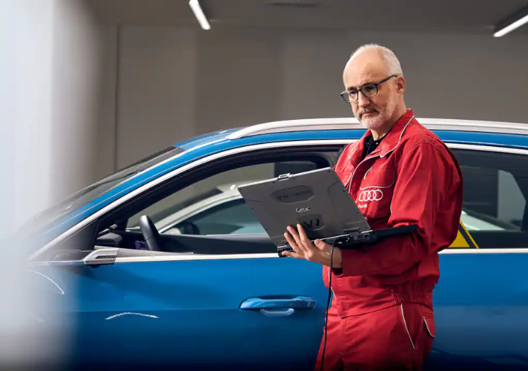 Audi technician looking at vehicle diagnosis