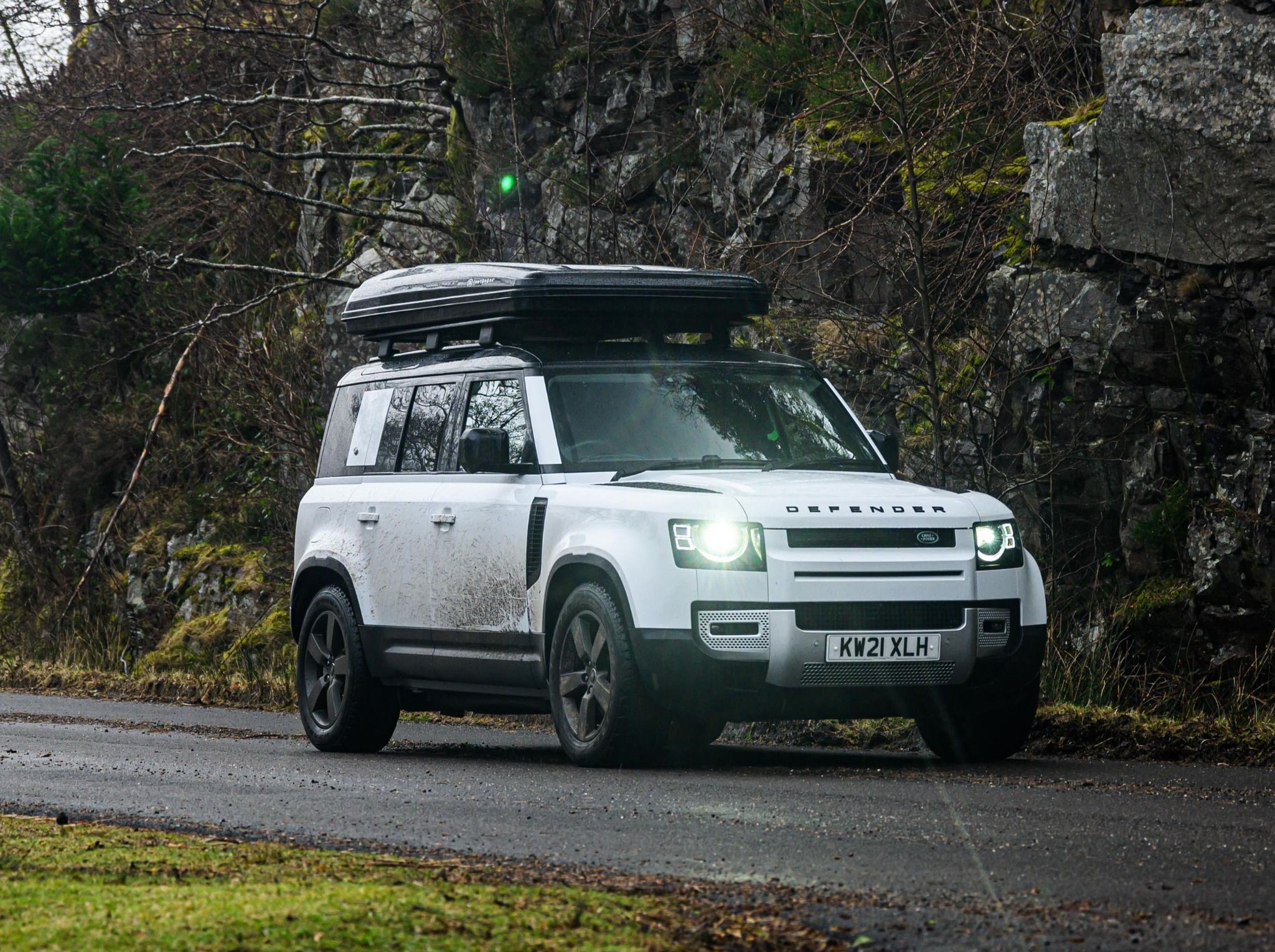 White defender parked on Rocky road