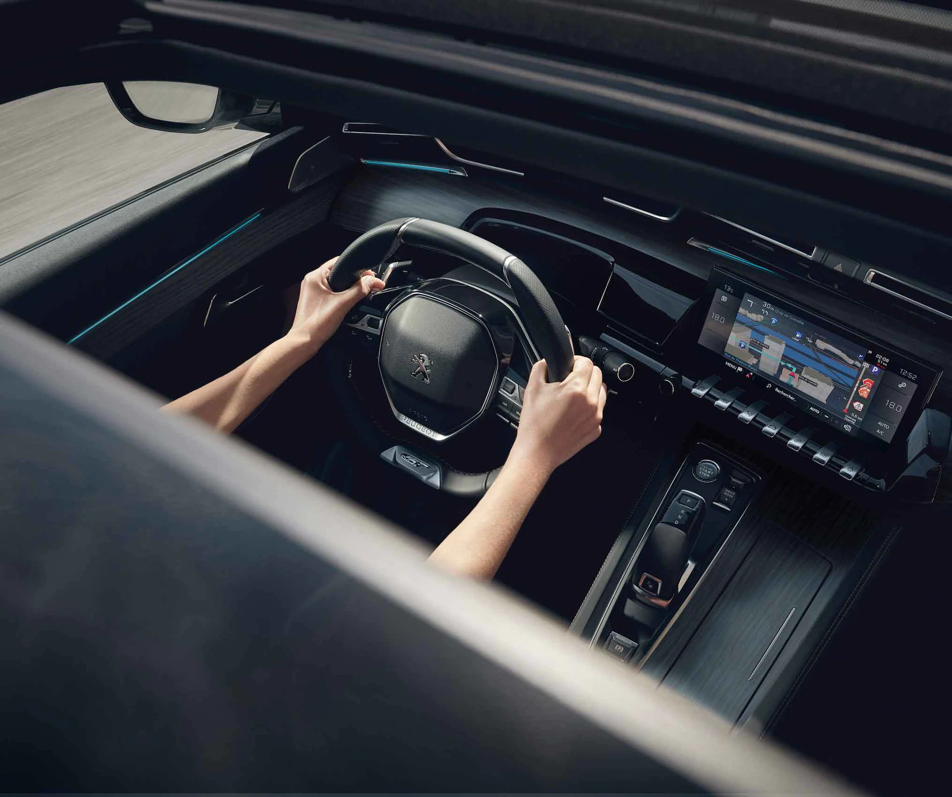 Sunroof view of person driving a Peugeot 508 SW