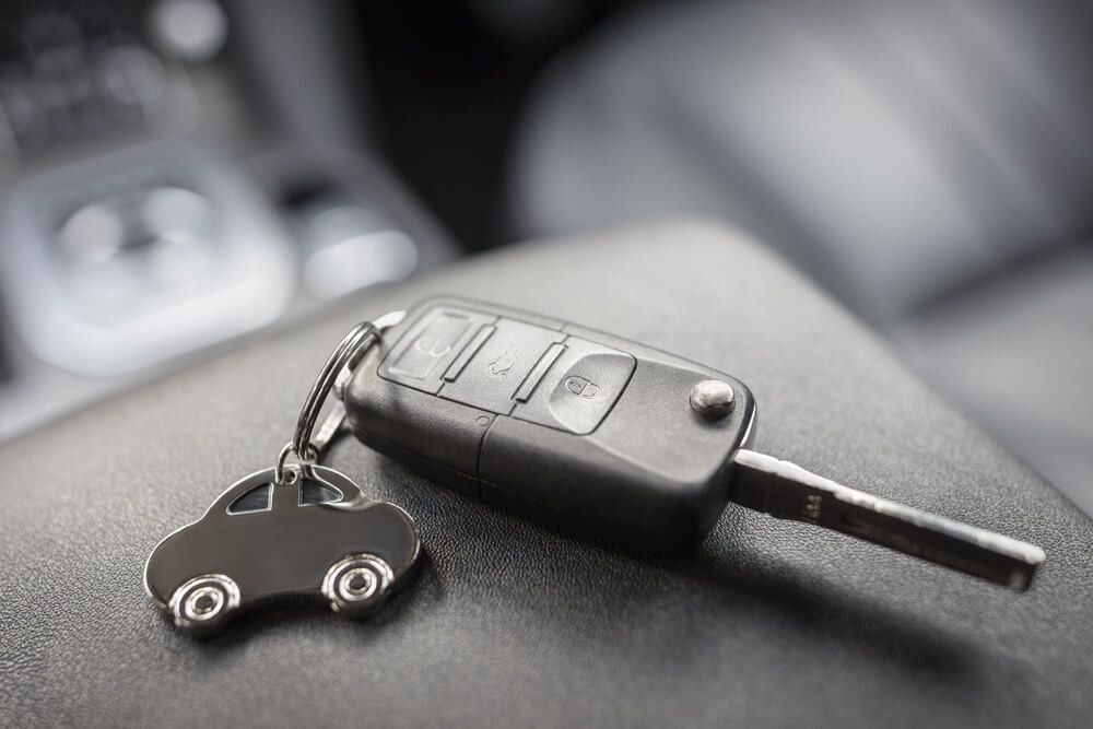 Car key with a car shaped keyring