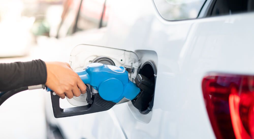 Close up of person fueling up car